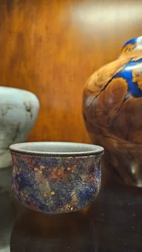 Customer's Celestial Bloom I bowl displaying a textured, multi-color finish with gold flecks.
