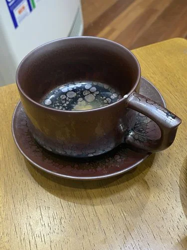 Avaliação com foto de um cliente sobre a xícara de café “Succulent”